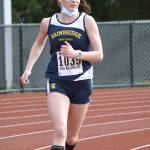 Lucy King makes her way down the track in a dual-meet with Central Kitsap. King finished second in her race behind teammate Eden Michael. (Photo courtesy of Rick Peters).