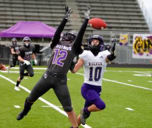 North Kitsap defensive back Lincoln Castillo (12) tries to get a hand on a pass intended for Sequims Garrett Hoesel (10). (Mark Krulish/North Kitsap Herald)