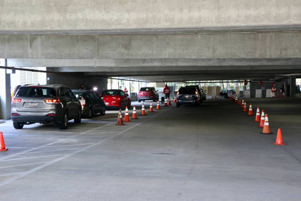 The lower half of the Suquamish Clearwater Casino parking garage was transformed into a drive- thru Covid vaccination clinic, complete with a waiting are for pateinets to monitor their reactions to the vaccines follwing the injection. (KPark).