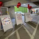 Volunteers from Chief Kitsap Academy, made encoruaging signs to thank and congratulate those who are getting vaccines. (KPark).