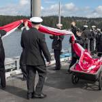 Sailors prepare to unfurl the homeward bound pennant as the crew mans the rails of the aircraft carrier USS Nimitz flight deck on Sunday afternoon as it returns to its homeport of Naval Base Kitsap in Bremerton. The 5,000-member crew sailed home after 11 months of deployment in waters in the North Arabian Sea, Indonesia and the Pacific. (Photo by Navy Mass Communications Spec. 2nd Class Donald L. White)