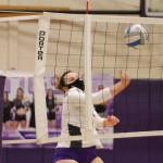 Vikings senior Autumn Carver punches a ball back over the net during a rally against Bainbridge. (Mark Krulish/Kitsap News Group)