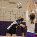 Bainbridge senior Allie Wildsmith leans into a hard shot to get it past the North Kitsap blockers. (Mark Krulish/Kitsap News Group)