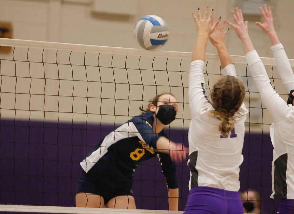 Bainbridge senior Allie Wildsmith leans into a hard shot to get it past the North Kitsap blockers. (Mark Krulish/Kitsap News Group)