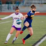 Sophia Castillo of North Kitsap tries to hold off Hailey Fink of Bainbridge. (Mark Krulish/Kitsap News Group)