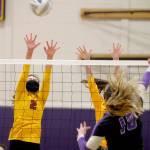 Kingstons Nizhoni Price tries to get in the way of Riley Rabedeauxs spike. (Mark Krulish/Kitsap News Group)