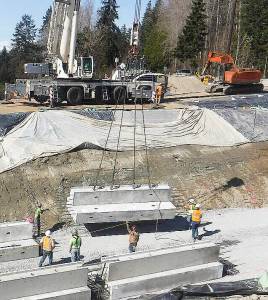 <em>A large crane places tunnel footings in position.</em>				 Courtesy photo