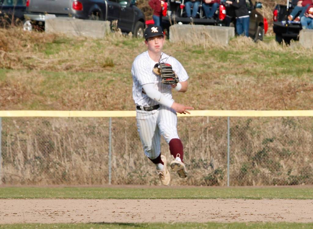 Rylen Bayne makes a difficult throw for an out against Sumner. Bayne also went 3-for-3 with a walk at the plate in the win. (Mark Krulish/Kitsap News Group)