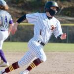 Ty Orser rounds third to score the tying run for South Kitsap against Sumner. (Mark Krulish/Kitsap News Group)
