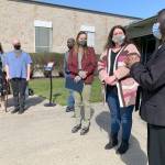 Helen Taylor, director of nursing at Washington Veterans Home of Retsil (at far right), congratulates business owners and community members for their work in support of the Full Circle Meals program at the WDVA facility. (Bob Smith | Kitsap Daily News)