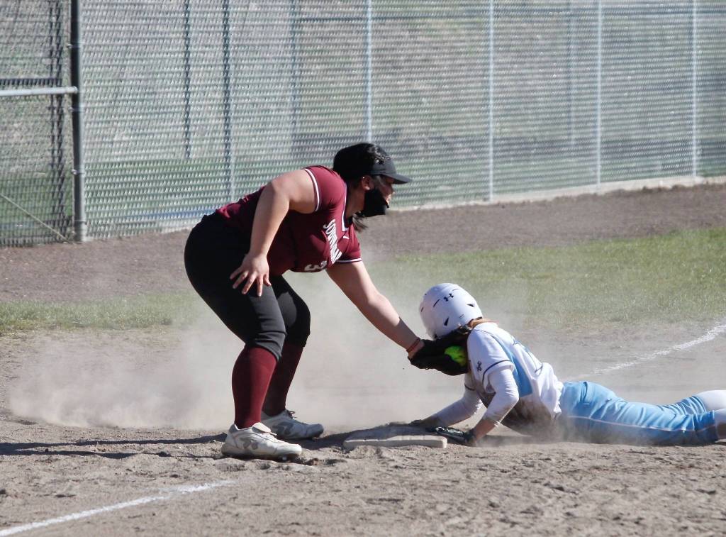 Jordan Blas applies the tag at third base. (Mark Krulish | Kitsap News Group)