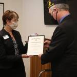 Rich Nugent, with American Legion Post #245, presented an award and check for $5,000 to Fishline executive director Lori Maxim. The American Legion is one of Fishlines partners in caring for the most vulnerable in the community. Ken Park/North Kitsap Herald