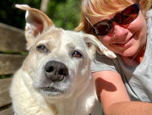Lee Harper, Kitsap Humane Societys new executive director, enjoys the outdoors with her dog Columbo, a 7-year-old yellow lab. (Contributed image)