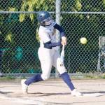 Ruby Raymundo hits one of her two doubles against Olympic. Raymundo finished the game with three hits and one RBI. (Mark Krulish/Kitsap News Group)