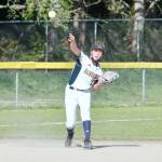 Grace Colburn makes the long throw from the shortstop position. (Mark Krulish/Kitsap News Group)