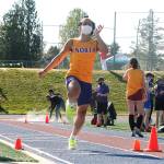 Lincoln Castillo makes his leap in the long jump. He finished third with a jump of 19 feet, 10.5 inches. (Mark Krulish/Kitsap News Group)