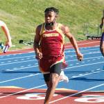 Kingstons Zawadi Leon takes runs the anchor leg in the 4x100. He finished third in the 200 and sixth in the 400. (Mark Krulish/Kitsap News Group)