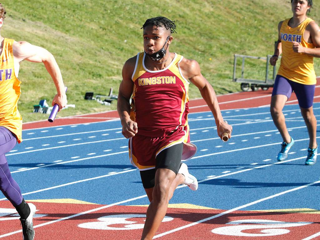 Kingstons Zawadi Leon takes runs the anchor leg in the 4x100. He finished third in the 200 and sixth in the 400. (Mark Krulish/Kitsap News Group)