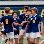 Bainbridge gathers to celebrate Ben Wilkinsons 30th-minute goal that ultimately helped the team clinch the Olympic League championship. (Mark Krulish/Kitsap News Group)