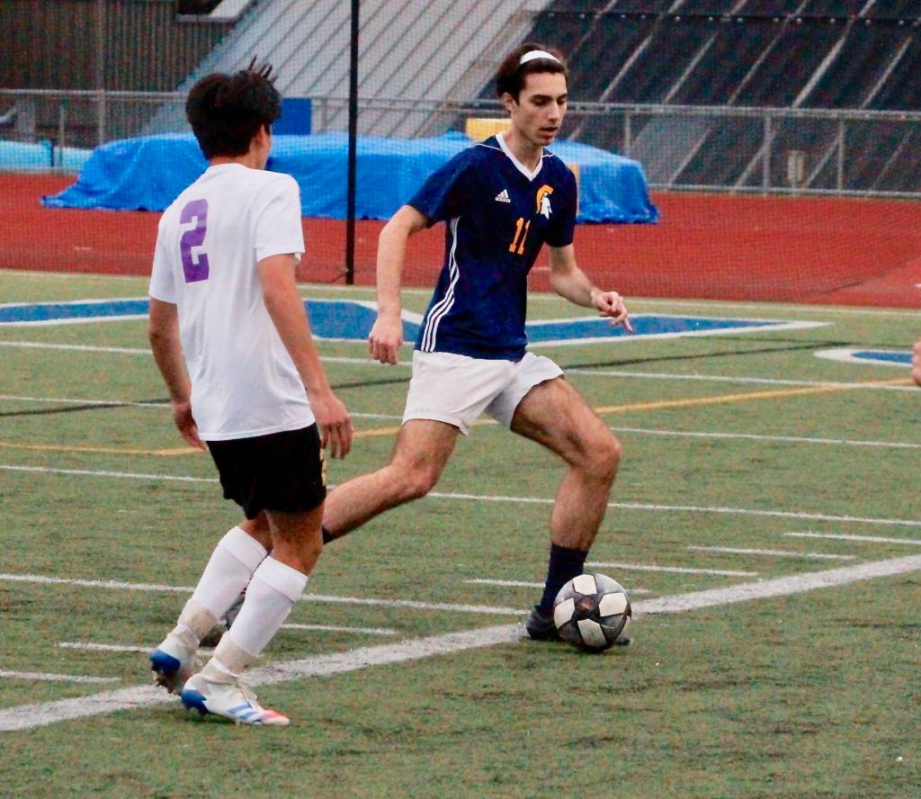 Sam Kuznetsov looks to get the ball upfield. (Mark Krulish/Kitsap News Group)