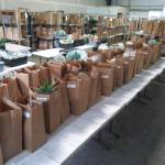 Finished product! Volunteers at Kitsap Fresh package food to be picked up or delivered from its Poulsbo warehouse. ( courtesy photo)