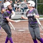 Alissa Dvorak (left) and Makayla Beaudoin (right) celebrate after Beaudoin scores the go-ahead run against Sequim on Dvoraks sacrifice fly. (Mark Krulish/Kitsap News Group)
