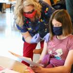 Eliora McDaniel, daughter of Dr. Luke McDaniel, is unphased as she gets her first  dose of the Pfizer vaccine.(KPark/NKH).