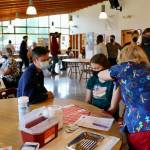 Anna McDaniel gets her first dose as Dad (Dr. Luke McDaniel) looks on. (KPark/NKH)