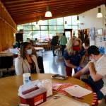 Mom (Jolene Sullivan) looks on as Fisher checks the injection site. (KPark/NKH)