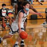 Bainbridge senior Jacob Kirsch evades the Central Kitsap defense on his way to the basket. (Mark Krulish/Kitsap News Group)