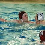 Kincaid Tyas (17) tries to hold off a charging Rylan Hopp as he sets up a pass. (Mark Krulish/Kitsap News Group)