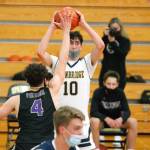 Alexander Treskin looks for an open teammate while Jonas La Tour (4) gets his hands up to block the passing lanes. (Mark Krulish/Kitsap News Group)