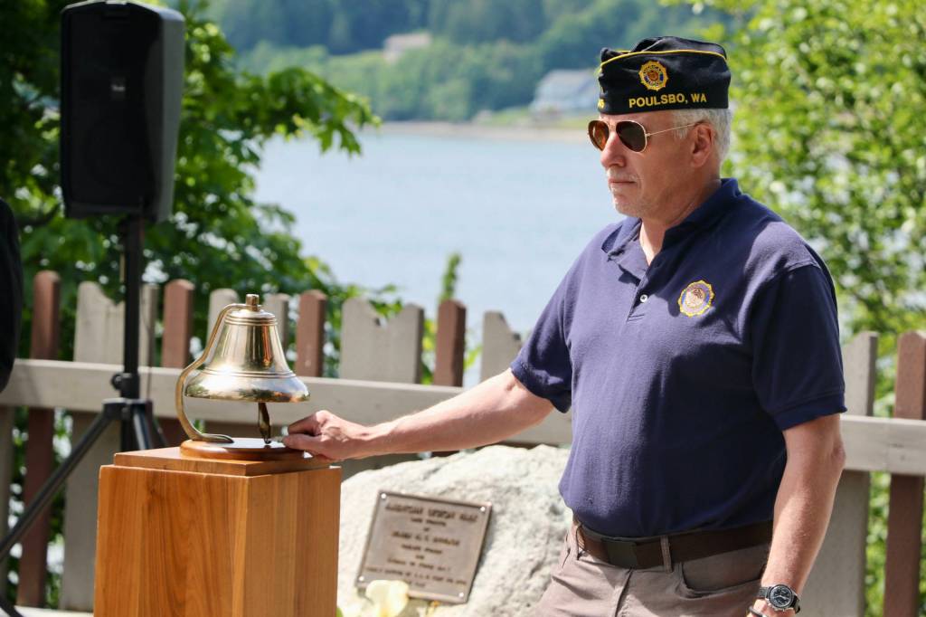 Daniel Phillips rings a bell to honor those who have fallen, specifically members of the American Legion Post 245 who passed away in the last year.