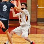 Sergio Roberts (4) looks for an open teammate as Gig Harbors Will Landram tries to obstruct his view. (Mark Krulish/Kitsap News Group)