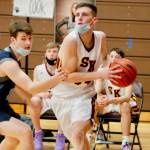 South Kitsap senior Rylan Zietlow dribbles past a Gig Harbor defender on his way to the basket. (Mark Krulish/Kitsap News Group)