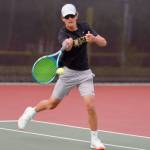 North Kitsaps Josh Smith attacks the net for a point as he did many times throughout the championship match victory. (Mark Krulish/Kitsap News Group)