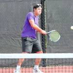 North Kitsaps Drake Jones returns a volley from the baseline during the Olympic League doubles finals match. (Mark Krulish/Kitsap News Group)