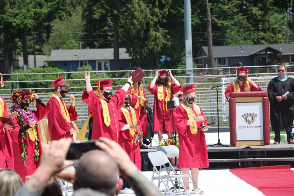 Let the celebration begin! An KHS grad, diploma in hand, reaches for the sky in joy.(KPark/NKH)