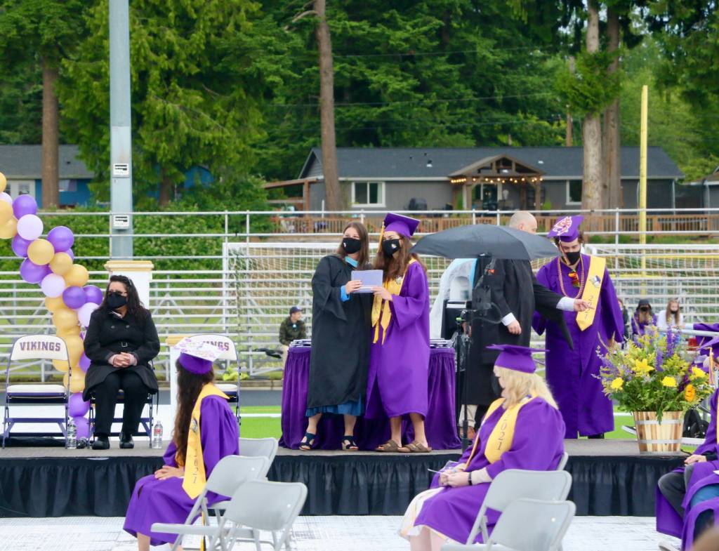 Students receives diplomas during NKHS 2021 Graduation. (KPark/NKH)