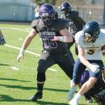 Cache Holmes, shown here chasing down Bainbridges Cal Breen, will play football and wrestle at Southern Virginia in the fall. (KNG File Photo)