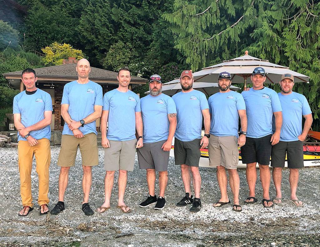 The group of eight who took on the first Bainbridge 50K Warrior Paddle. From left to right: Jimmy Lee Burruss, US Navy & Coast Guard pilot from Spokane; Matt Kress, a USMC Logistics Officer from Bainbridge; Matt Sivright, USMC Infantry from Seattle; Eric Longo, USMC Infantry, from Silverdale; Dan Dinsmore, USMC Motor Transportation, from Bainbridge; Chad Rounds, USMC Harrier Pilot, FBI, from Camas; Ryan Hough, USMC Harrier Pilot, from Bainbridge; and Matt McLaughlin, USMC Harrier Pilot, from Hood River. (Contributed photo)