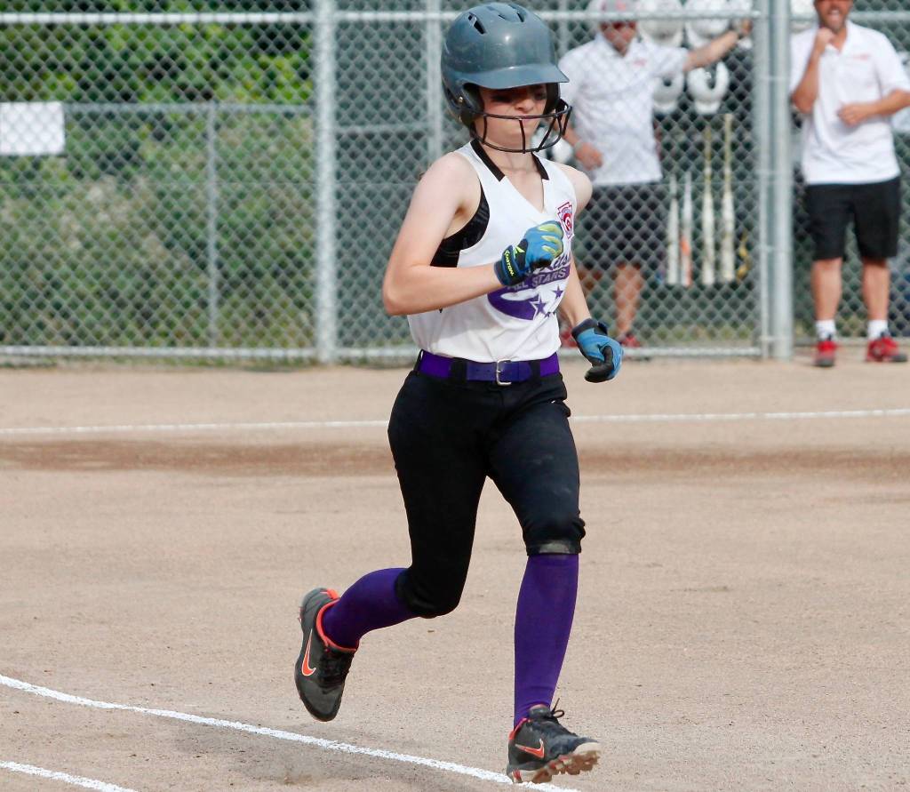 Keira Martin hustles down to first base on a ground ball. Martin picked up seven hits and eight RBI during the final two games against Gig Harbor. (Mark Krulish/Kitsap News Group)