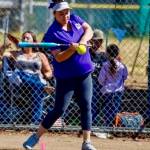 North Kitsap Little League Junior All Stars manager Mackenzie Fisher hits grounders before the game.