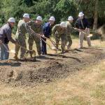 Navy officials and U.S. Rep. Derek Kilmer turn over shovels of dirt to signify the official start of the project to modernize the Manchester Fuel Depots fuel storage capability. (Bob Smith | Kitsap Daily News)