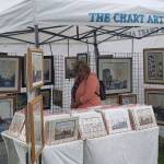 A visitor peruses through various maps and photos of Western Washington areas.