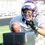 Happy to be back  North Kitsap sophomore EJ Vailolo goes for the ball in a drill during this weeks football practice. The Vikings first game is Sept. 3. (Mark Krulish/Kitsap News Group)