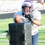 Happy to be back  North Kitsap sophomore EJ Vailolo goes for the ball in a drill during this weeks football practice. The Vikings first game is Sept. 3. (Mark Krulish/Kitsap News Group)