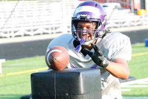 Happy to be back  North Kitsap sophomore EJ Vailolo goes for the ball in a drill during this weeks football practice. The Vikings first game is Sept. 3. (Mark Krulish/North Kitsap Herald photos)
