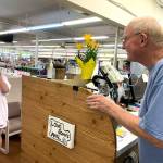Customer Laura Reedy to retiring pharmacist Ken Paskett: Ken, you cant leave us! she said with a smile. What will we do without you? (Bob Smith | Kitsap Daily News)
