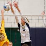 Bainbridge middle blocker Holley McFadden gets in the way of a Kingston shot during her teams victory over the Bucs on Thursday. (Mark Krulish/Kitsap News Group)